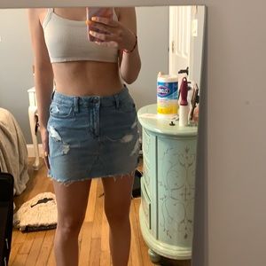 Ripped denim mini skirt